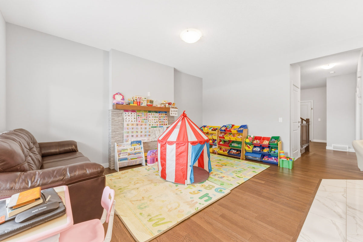 Flexible family playroom in a Calgary home for families moving from Winnipeg
